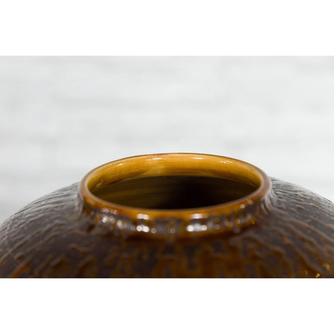 This-is-a-picture-of-a-Vintage Artisan Prem Collection Two-Toned Ceramic Jar with Caramel Toned Glaze-with-image-position-2-style-YN3539-Shop-for-Vintage-and-Antique-Asian-and-Chinese-Furniture-for-sale-at-FEA Home-NYC