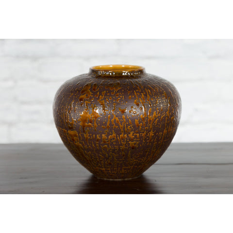 This-is-a-picture-of-a-Vintage Artisan Prem Collection Two-Toned Ceramic Jar with Caramel Toned Glaze-with-image-position-4-style-YN3539-Shop-for-Vintage-and-Antique-Asian-and-Chinese-Furniture-for-sale-at-FEA Home-NYC