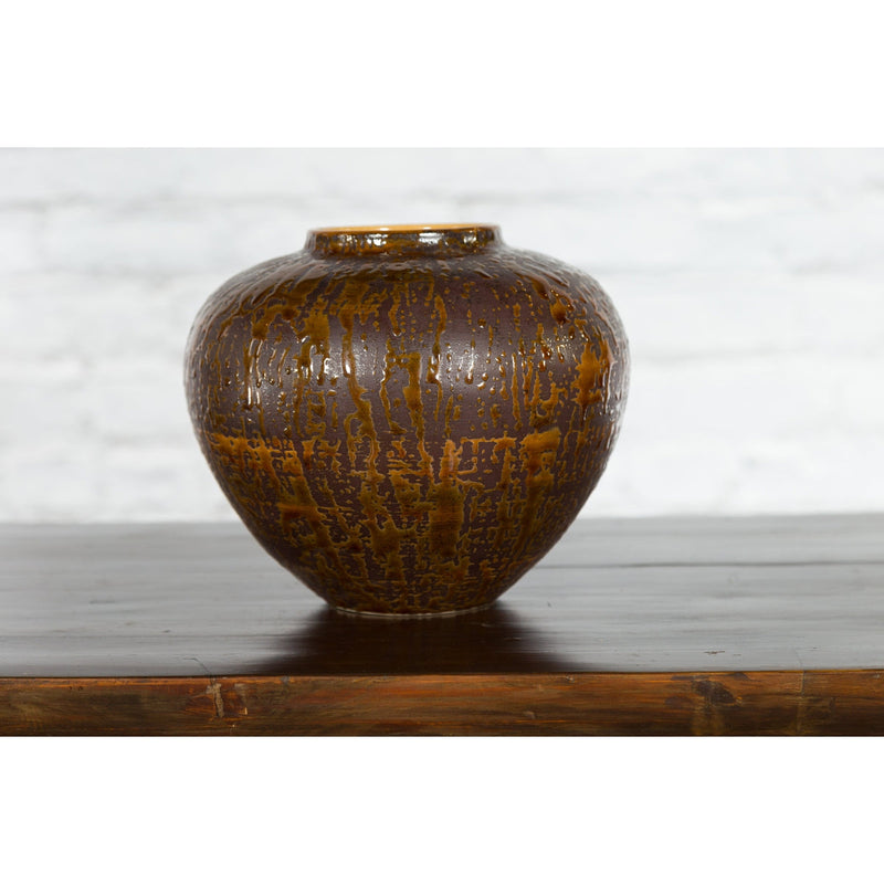 This-is-a-picture-of-a-Vintage Artisan Prem Collection Two-Toned Ceramic Jar with Caramel Toned Glaze-with-image-position-7-style-YN3539-Shop-for-Vintage-and-Antique-Asian-and-Chinese-Furniture-for-sale-at-FEA Home-NYC