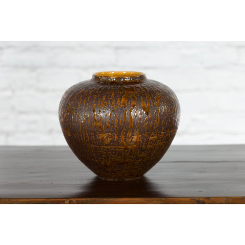 This-is-a-picture-of-a-Vintage Artisan Prem Collection Two-Toned Ceramic Jar with Caramel Toned Glaze-with-image-position-9-style-YN3539-Shop-for-Vintage-and-Antique-Asian-and-Chinese-Furniture-for-sale-at-FEA Home-NYC