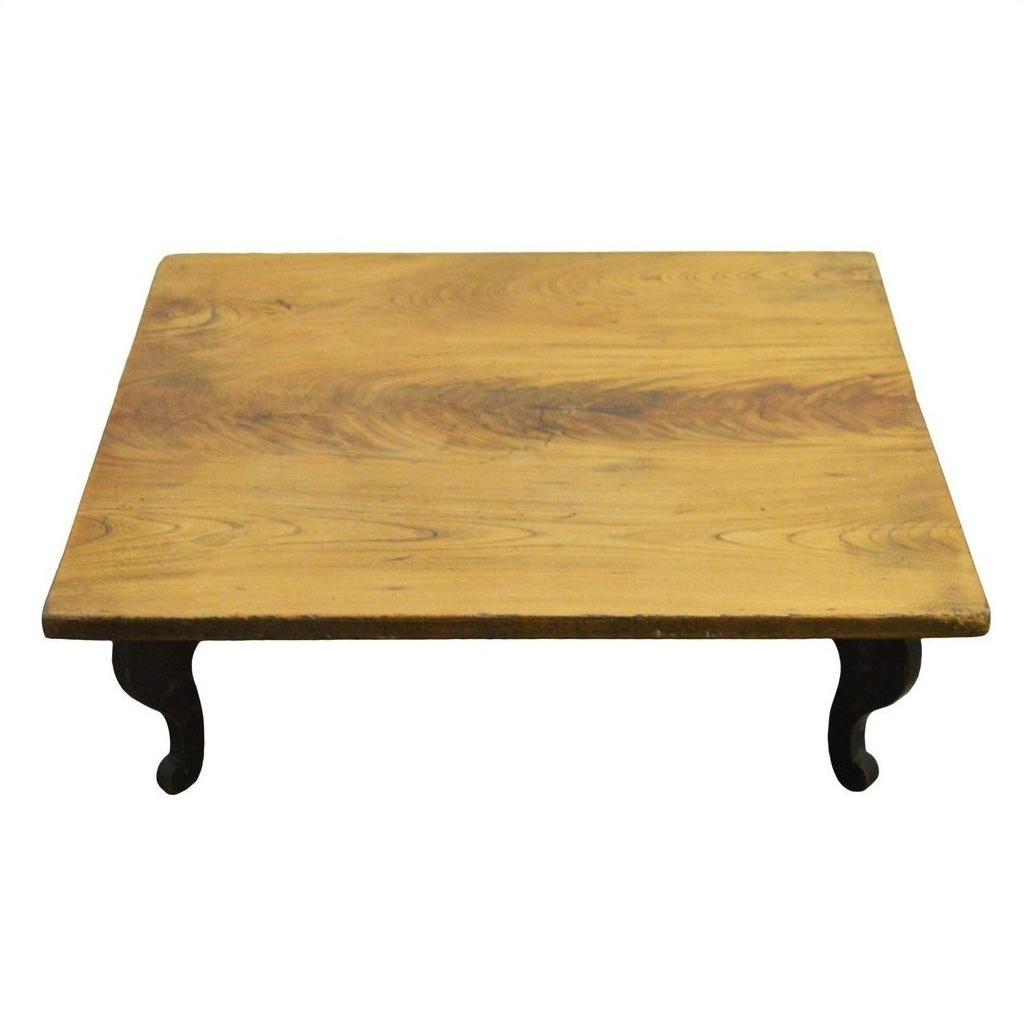Natural teak vintage Chinese coffee table with short curved legs on a plain white background.