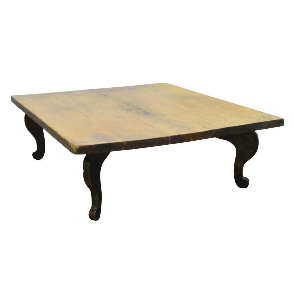 Natural teak Chinese coffee table with curved legs, vintage style, close-up of smooth wood tabletop.