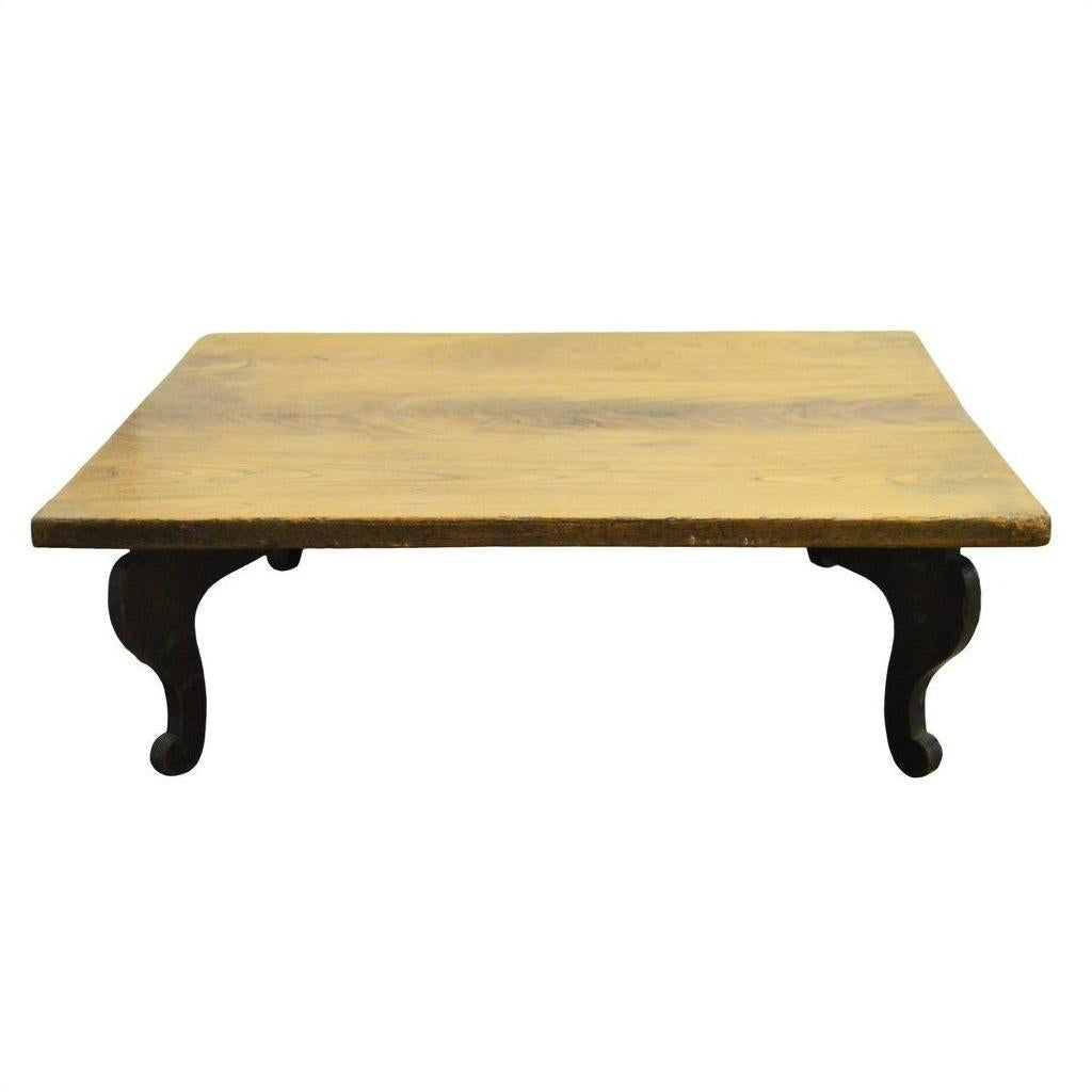 Natural teak vintage Chinese coffee table with curved legs, displayed against a plain white background.
