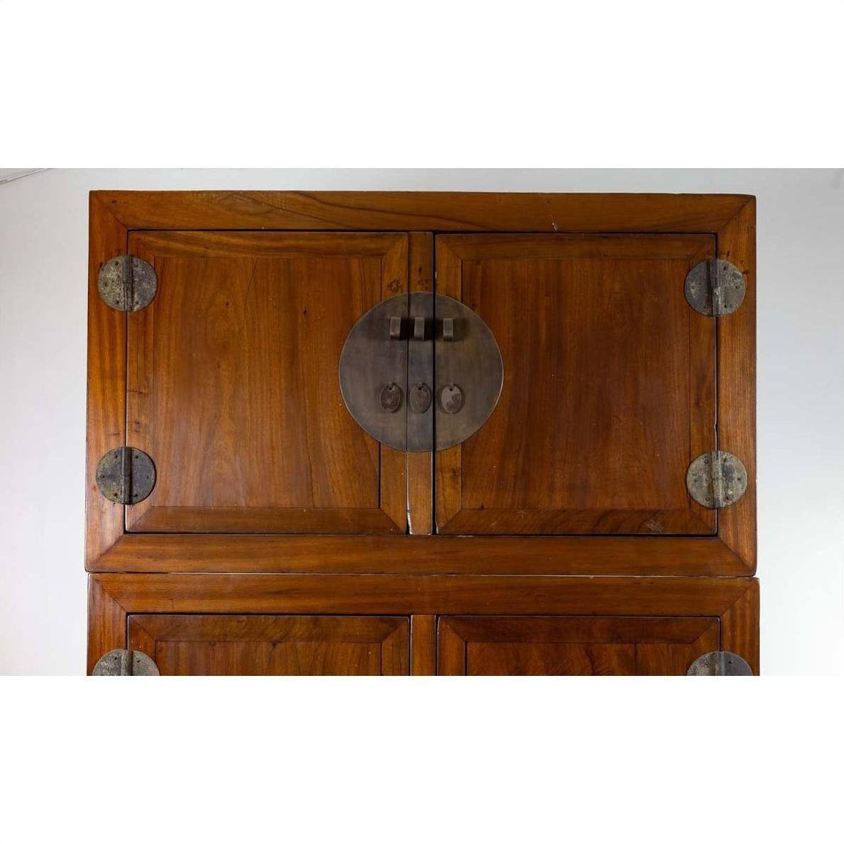 Brown Chinese elm wood wedding wardrobe with metal hinges and upper double doors, two-piece construction.