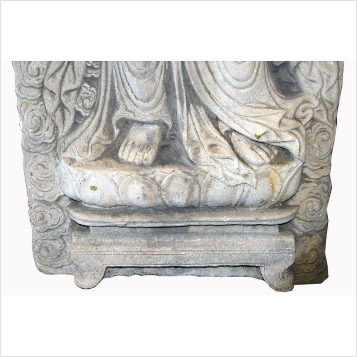 White stone Bodhisattva sculpture with lotus pedestal and floral carvings, hand-carved, vintage style.