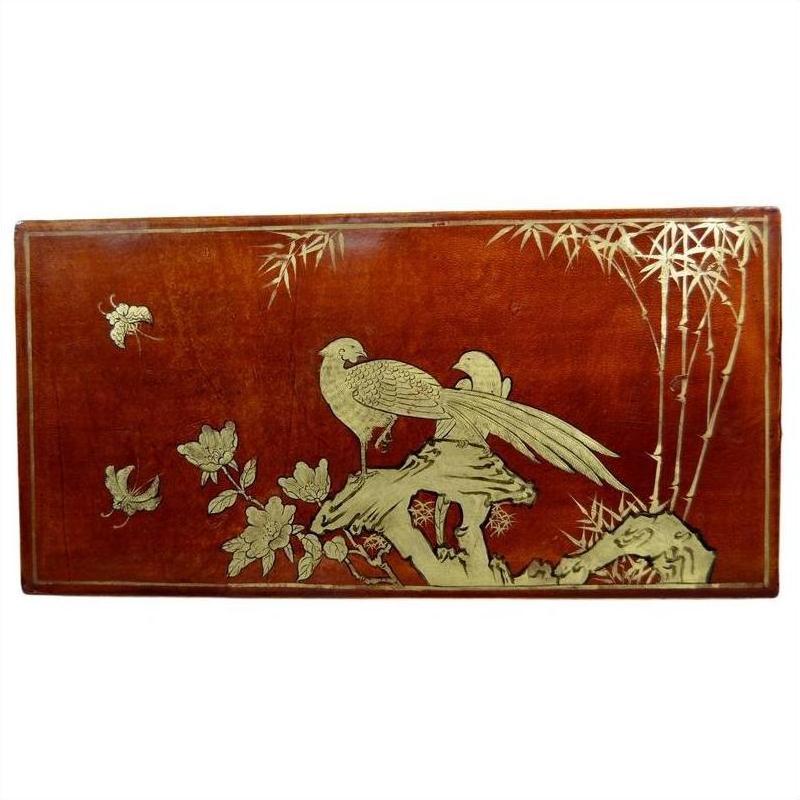 Reddish-brown lacquered wood dowry box with hand painted golden birds, flowers, and bamboo close-up.