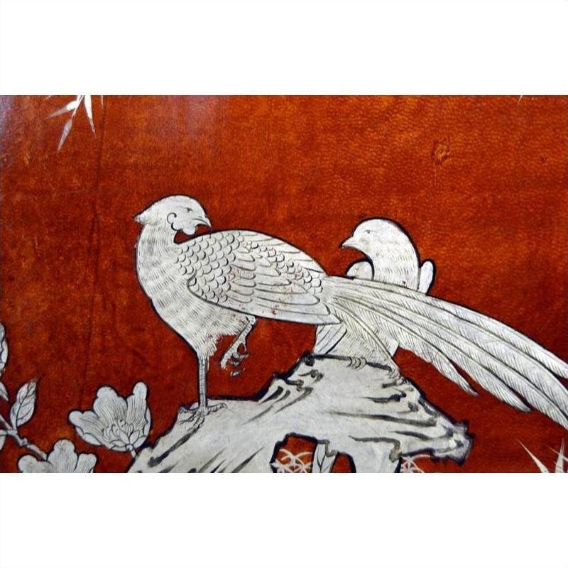 Black lacquered dowry box with hand-painted silver birds and long tails, floral details, vintage Chinese style, close-up.
