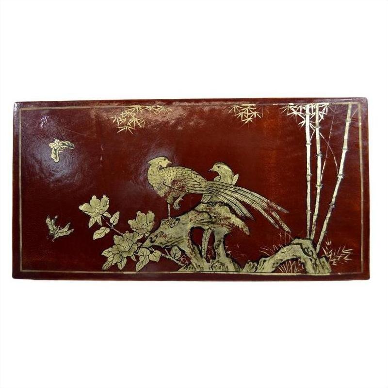 Dark brown lacquered wood dowry box with gold hand painted birds, flowers, and bamboo, close-up view.