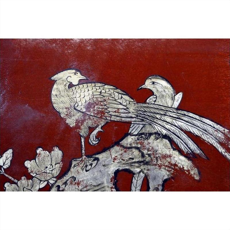 Red lacquered box with hand-painted gold birds and long tails perched on a branch, vintage Chinese style.