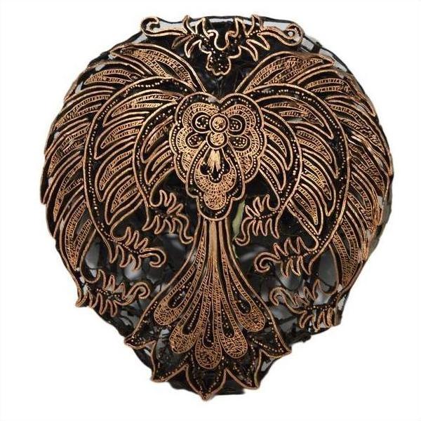 Close-up of vintage copper Batek ink block featuring bold, stylized bird patterns and ornate engraved details.