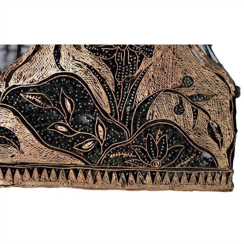Close-up of vintage copper Batek ink block with engraved floral, leaf, and geometric patterns featuring intricate detail.