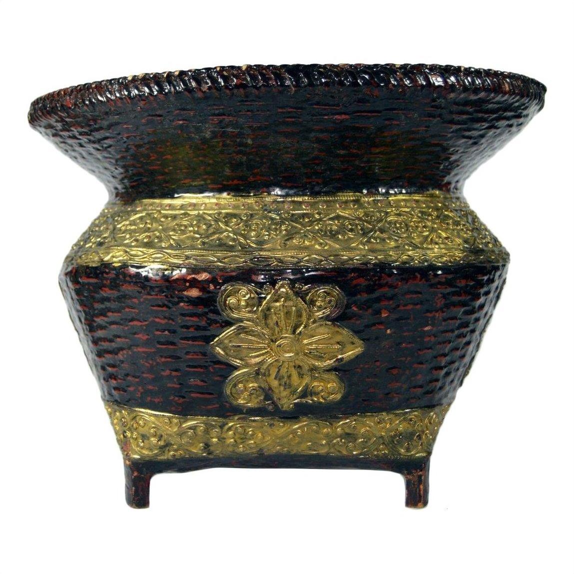 Brown woven bamboo basket with wide flared rim, floral pattern, gilt accents on raised base, close-up.
