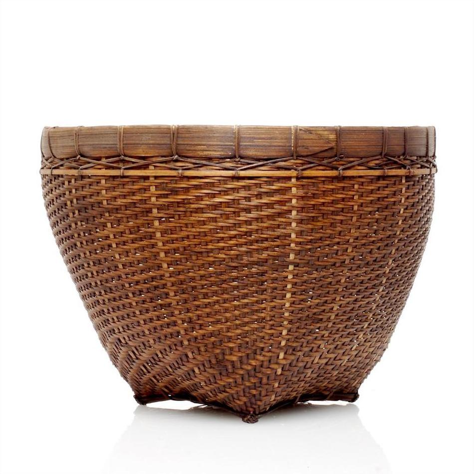 Large round hand-stitched rattan basket with sturdy rim on a white background.