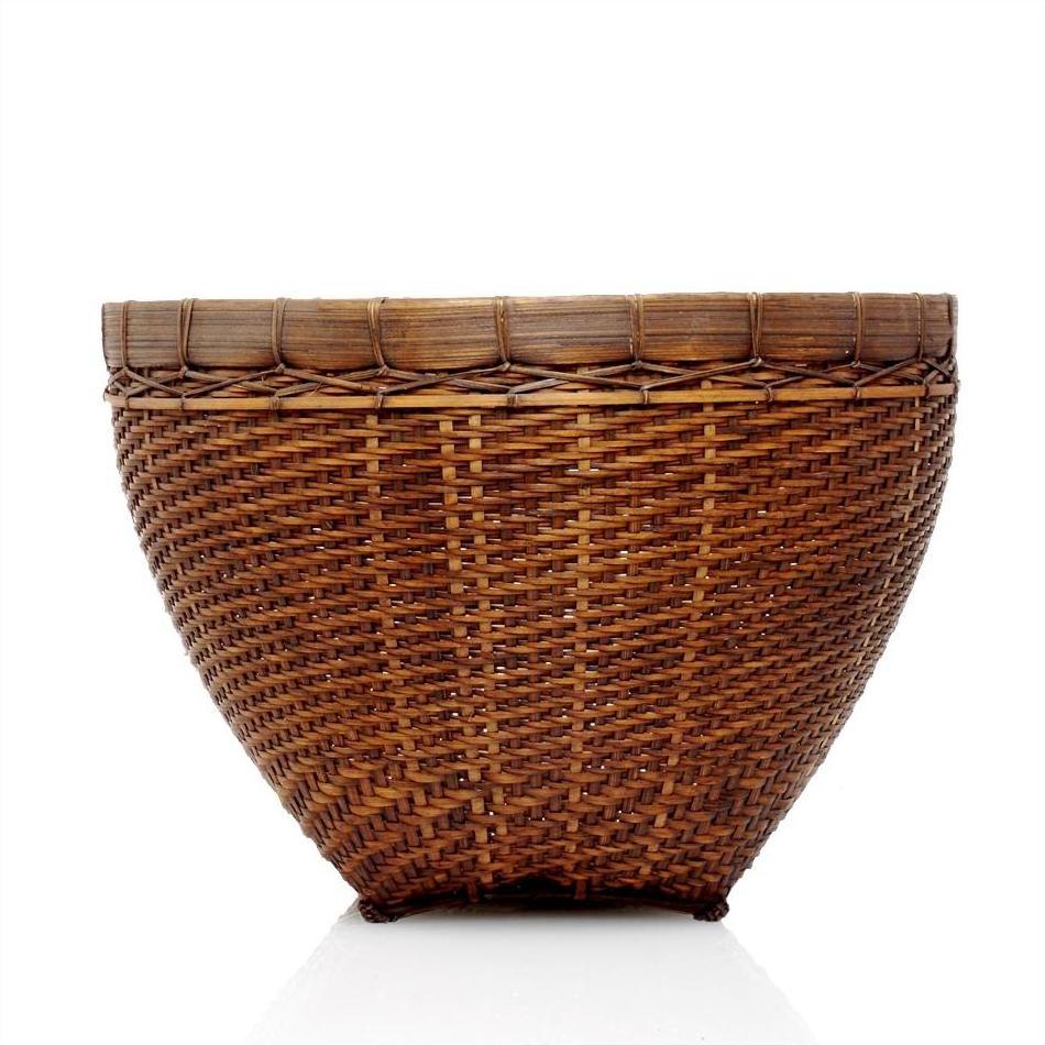 Large round rattan woven basket with wide opening, natural color, close-up on white background.