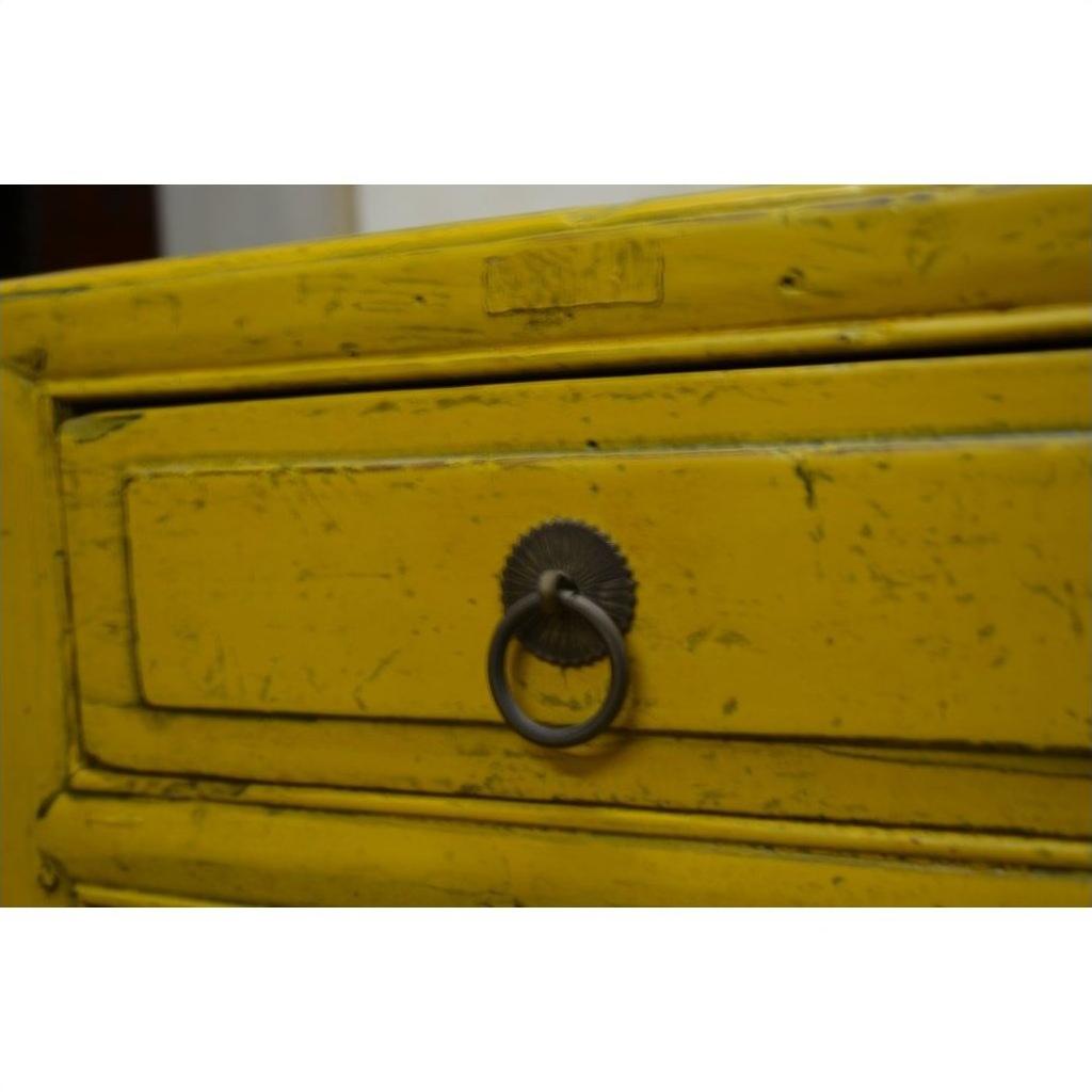 Close-up of yellow wood drawer with distressed finish and round metal pull handle from Yellow Side Tables.